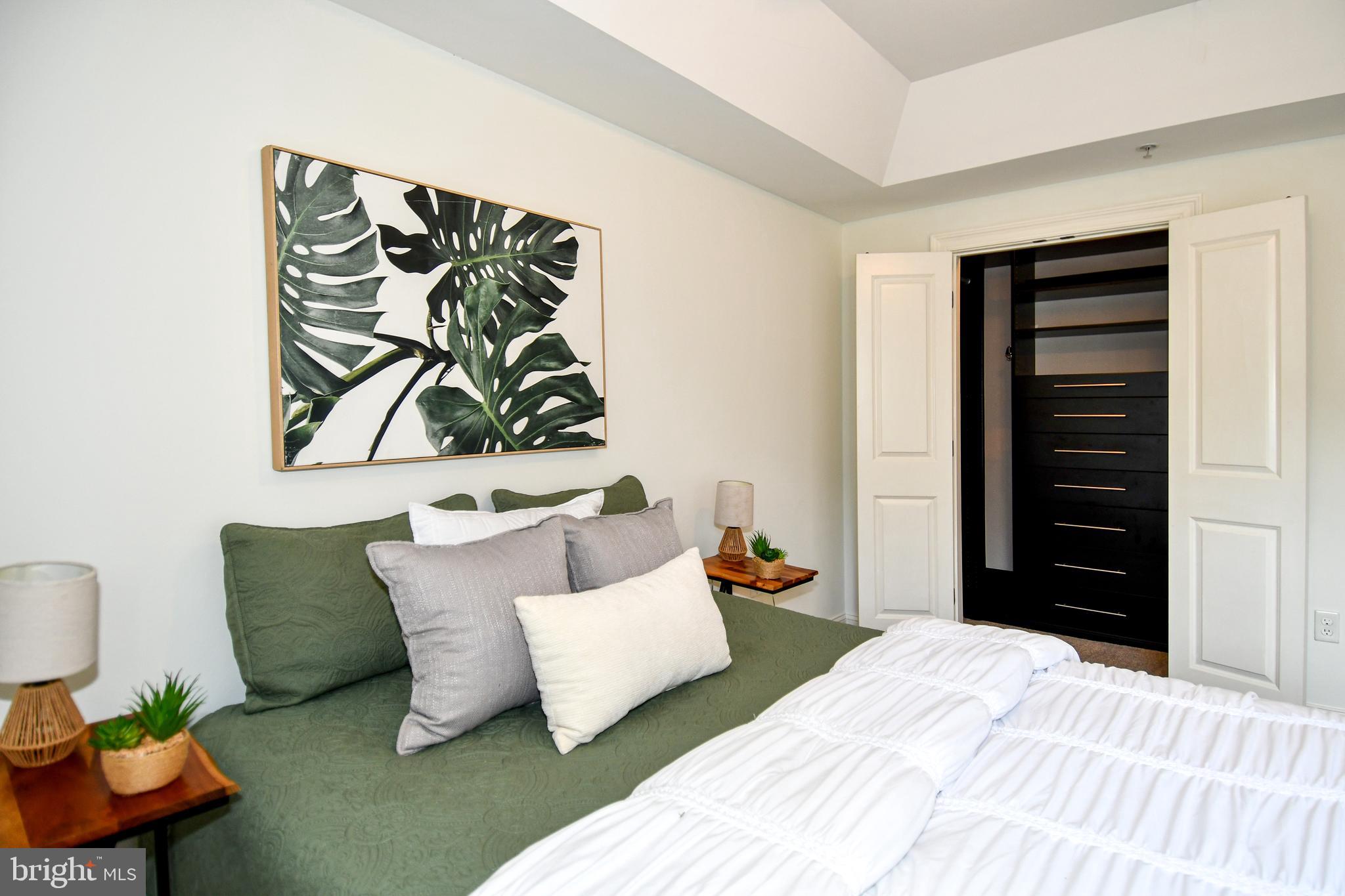 6301 Edsall Road, Unit 115 Alexandria, VA 22312 - Photo 15 of 37 a bedroom with a bed and a couch