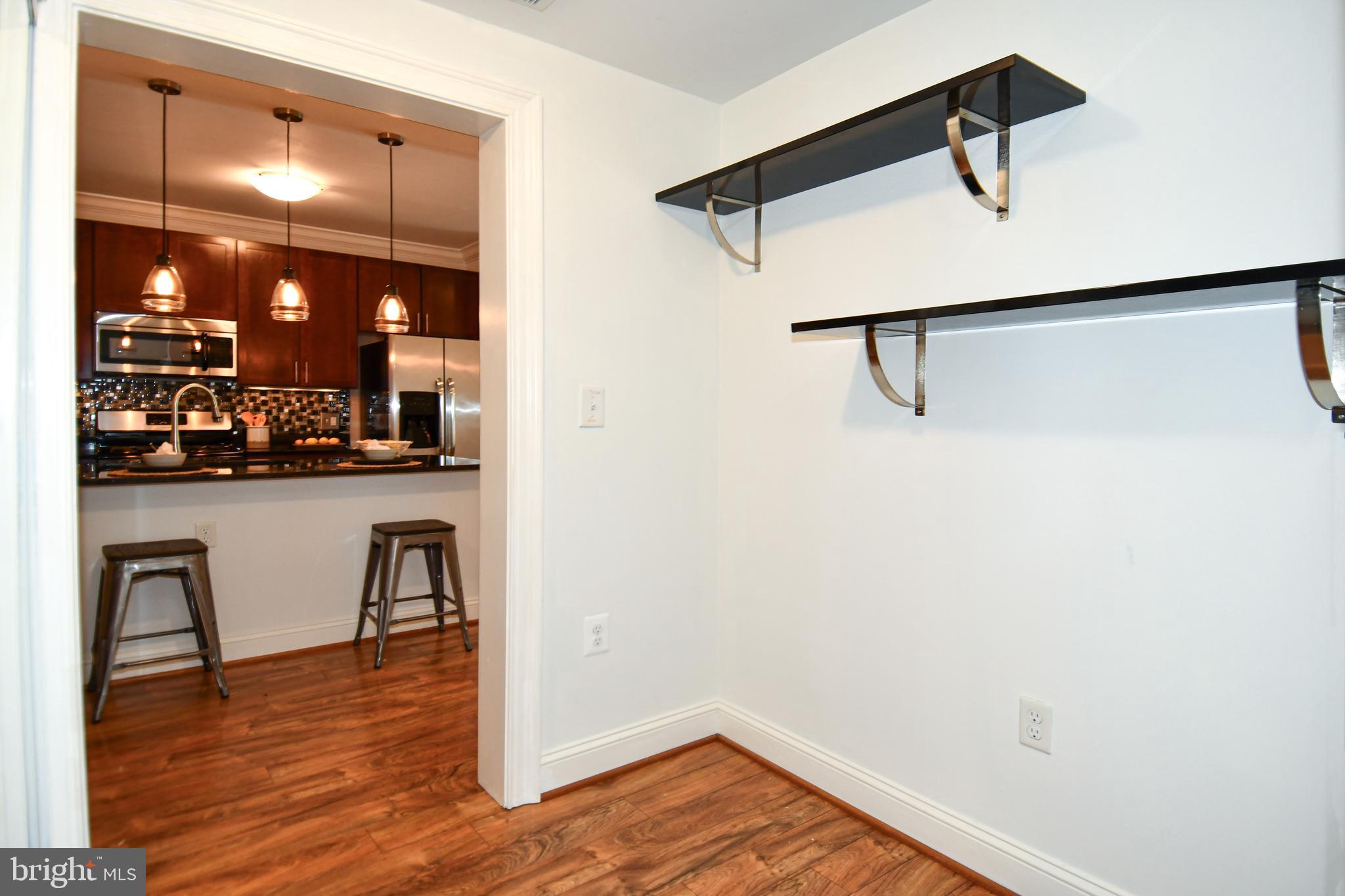 6301 Edsall Road, Unit 115 Alexandria, VA 22312 - Photo 19 of 37 a view of a kitchen and dining room
