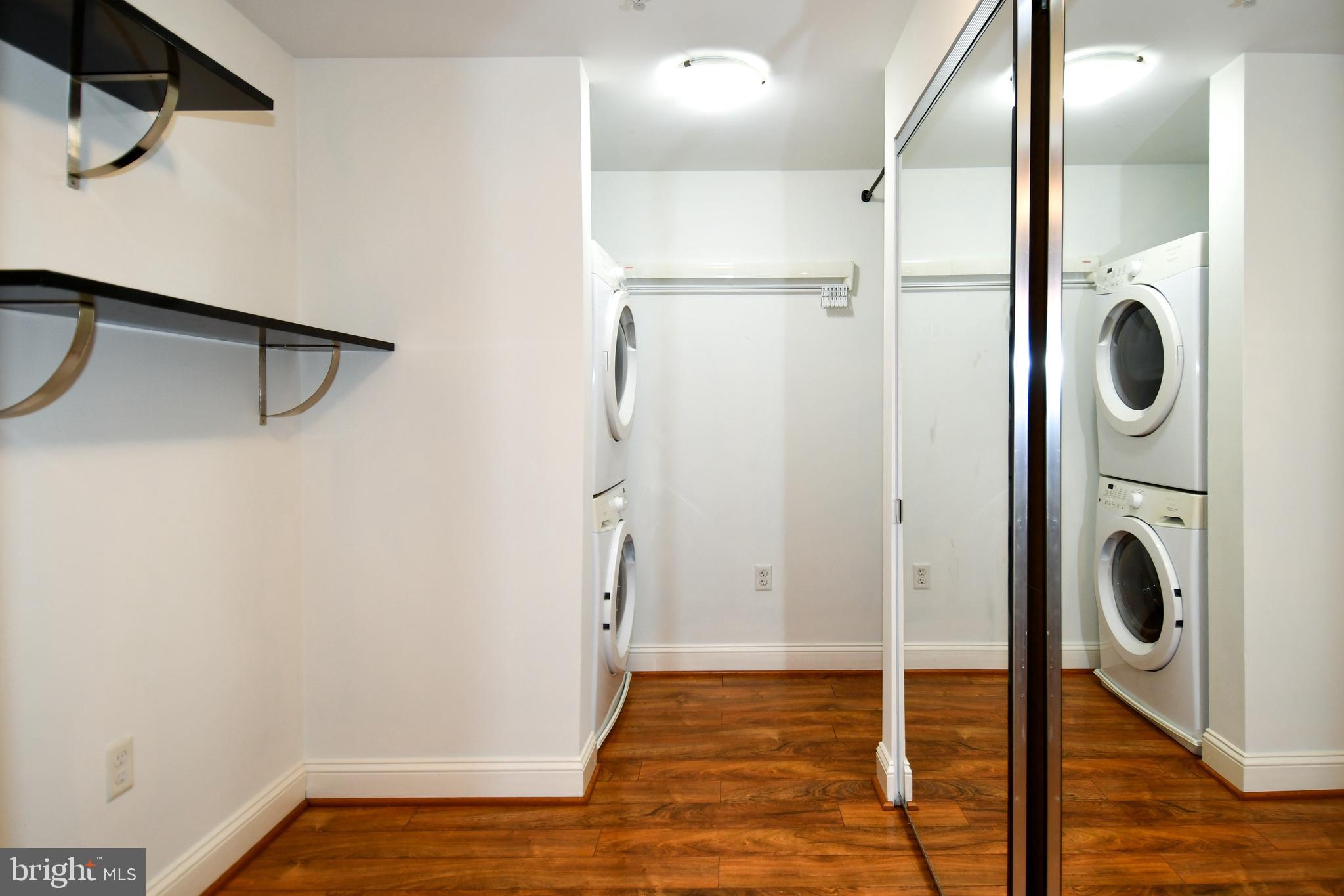 6301 Edsall Road, Unit 115 Alexandria, VA 22312 - Photo 20 of 37 a view of a hallway with washer and dryer