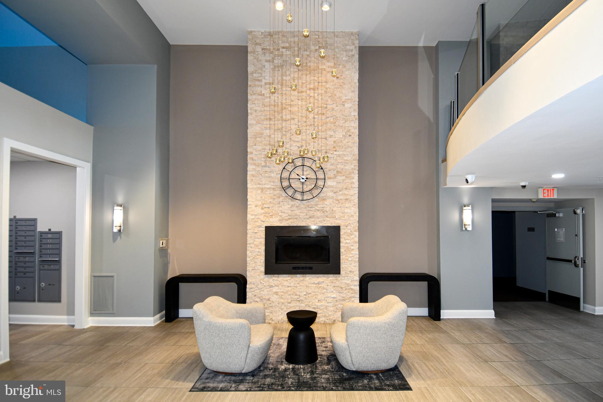 6301 Edsall Road, Unit 115 Alexandria, VA 22312 - Photo 31 of 37 a living room with furniture and a flat screen tv