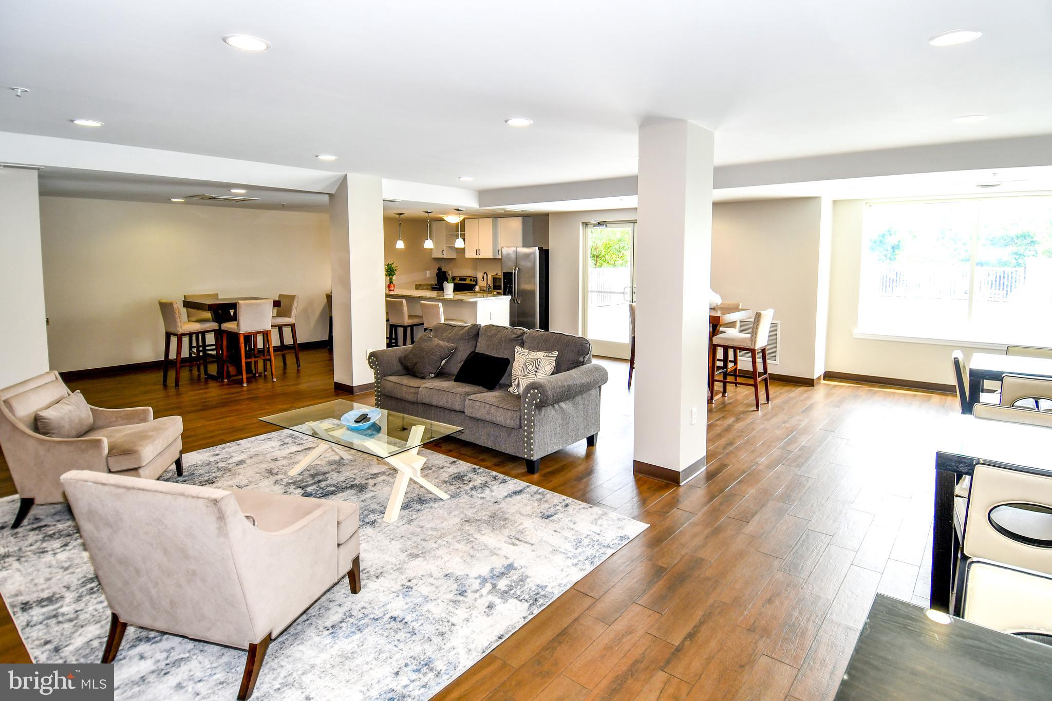 6301 Edsall Road, Unit 115 Alexandria, VA 22312 - Photo 34 of 37 a living room with furniture and a wooden floor