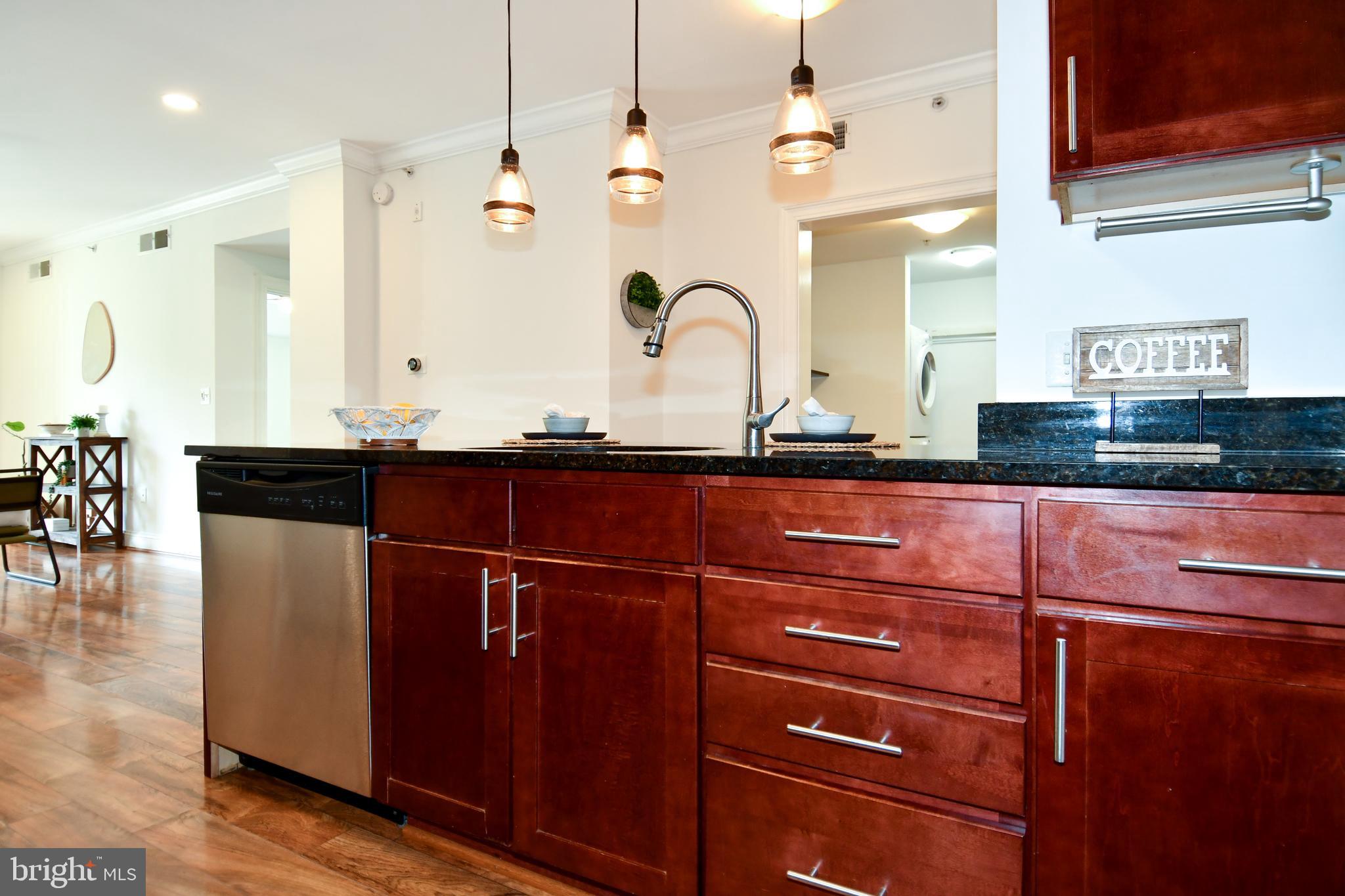 6301 Edsall Road, Unit 115 Alexandria, VA 22312 - Photo 5 of 37 a kitchen with a sink and cabinets