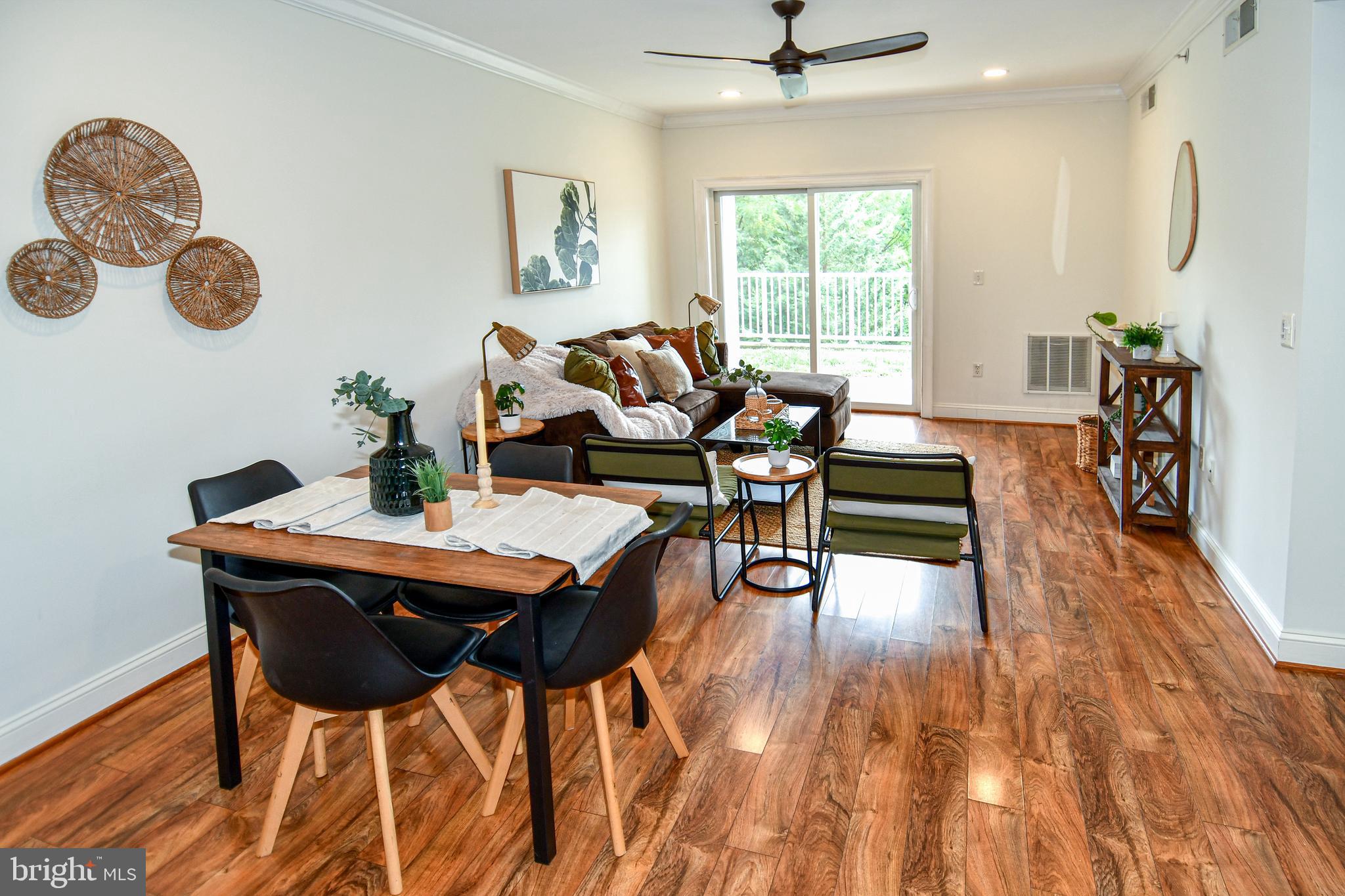 6301 Edsall Road, Unit 115 Alexandria, VA 22312 - Photo 8 of 37 a dining room with furniture a chandelier and wooden floor