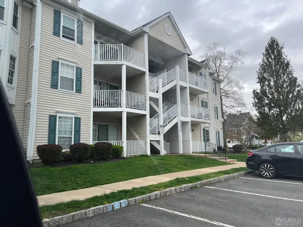 a view of a building with a yard