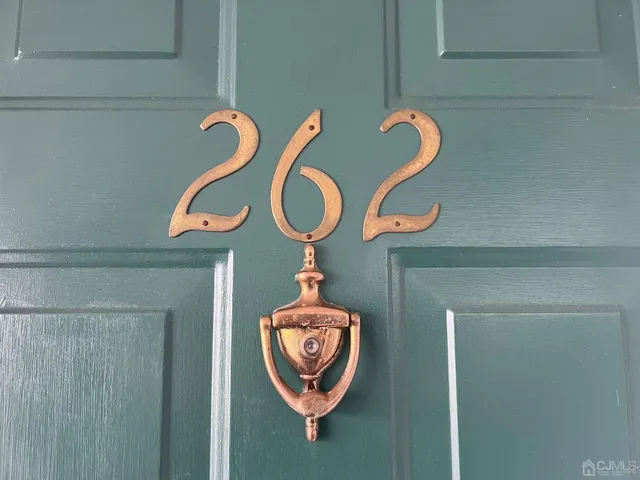 a kitchen with stainless steel appliances granite countertop a refrigerator stove and cabinets