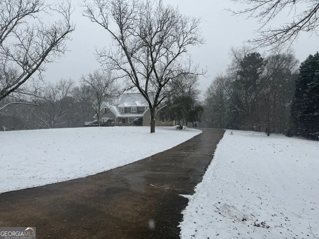a view of a backyard of snow