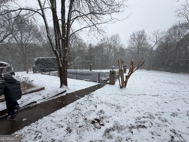 a view of snow on the road