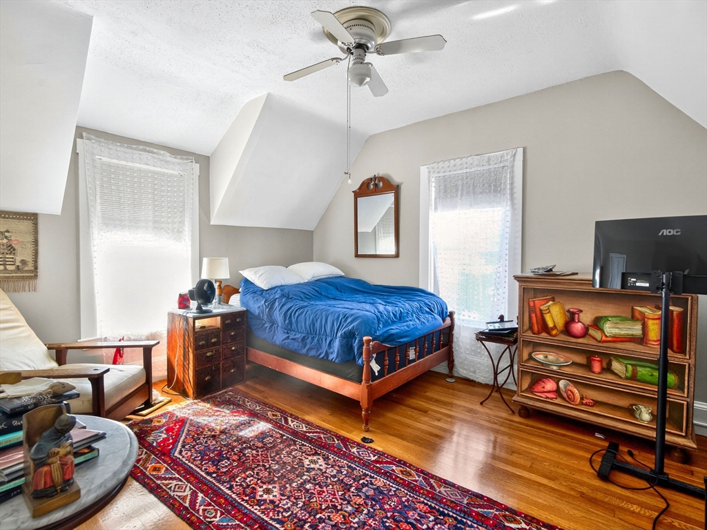 148 Beaver Street Boston, MA 02136 - Photo 17 of 25 a bedroom with furniture and wooden floor