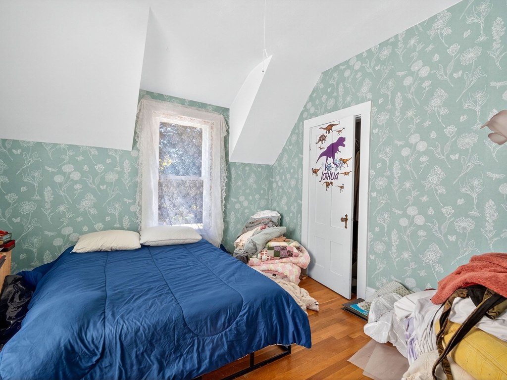 148 Beaver Street Boston, MA 02136 - Photo 19 of 25 a bedroom with a bed and a window