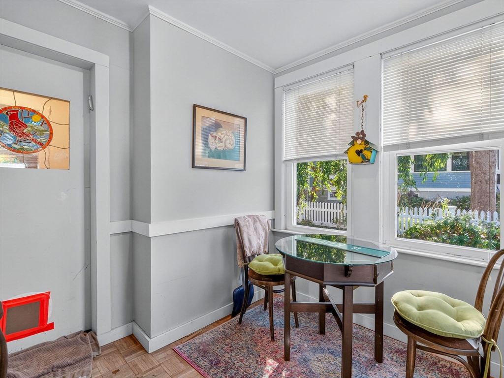 148 Beaver Street Boston, MA 02136 - Photo 20 of 25 a view of a dining room with furniture a chandelier and a window