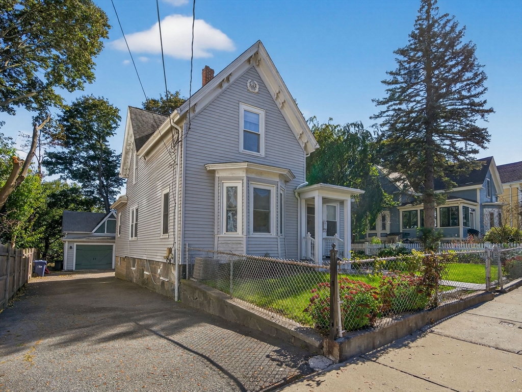 148 Beaver Street Boston, MA 02136 - Photo 2 of 25 a front view of house with yard and green space