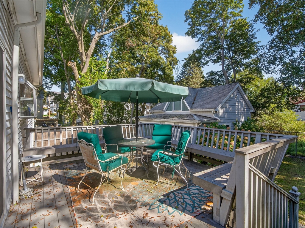 148 Beaver Street Boston, MA 02136 - Photo 8 of 25 a view of a chairs and table under an umbrella