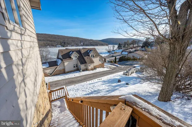a view of a backyard with sitting area