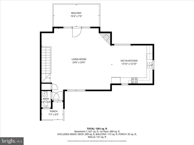 a picture of a room with a white wall and a refrigerator