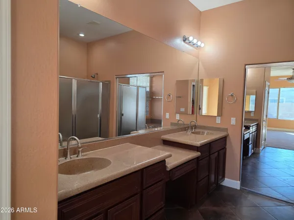 a view of a hallway to a livingroom with furniture