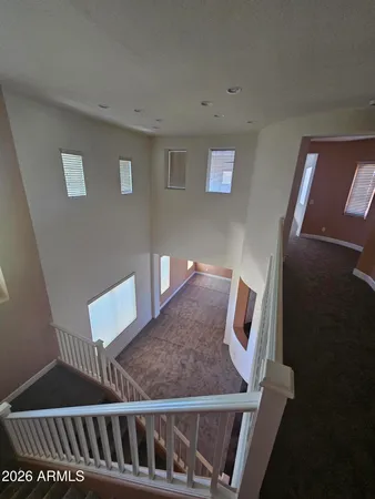 a view of a livingroom with an empty space and a window