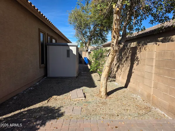 a view of grassy field with benches