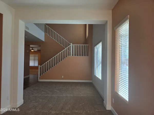 a view of a hallway view with staircase