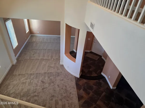 a view of kitchen with refrigerator and microwave
