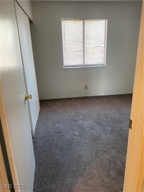 3717 Snorkel Circle, Unit C Las Vegas, NV 89108 - Photo 13 of 17 Unfurnished bedroom featuring carpet and a closet