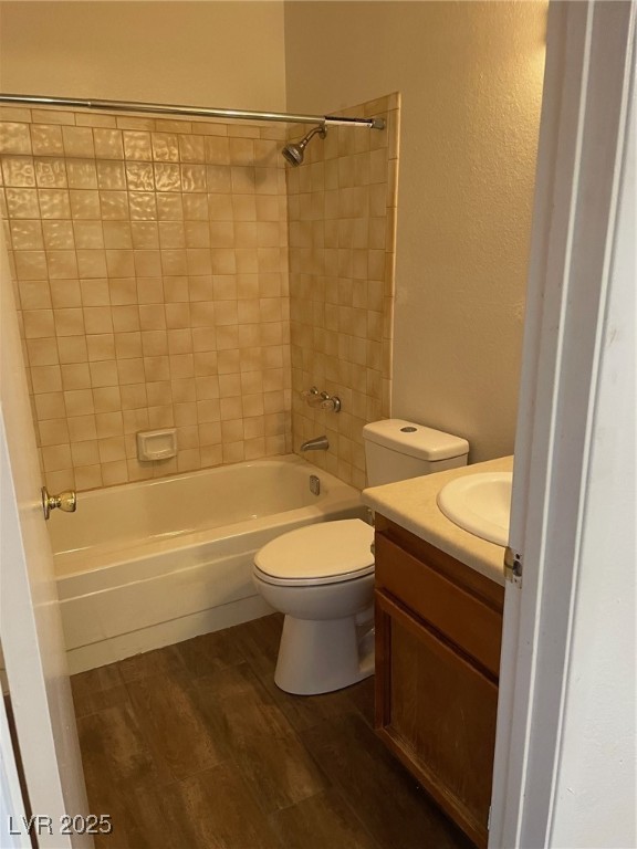 3717 Snorkel Circle, Unit C Las Vegas, NV 89108 - Photo 15 of 17 Bathroom with vanity, shower / bathtub combination, and dark wood-type flooring