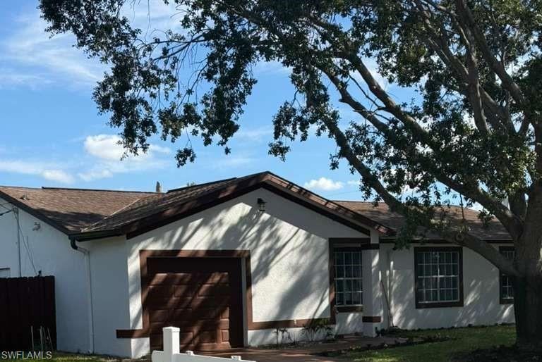 3190 52nd Lane Southwest Naples, FL 34116 - Photo 2 of 3 a view of a house with a tree
