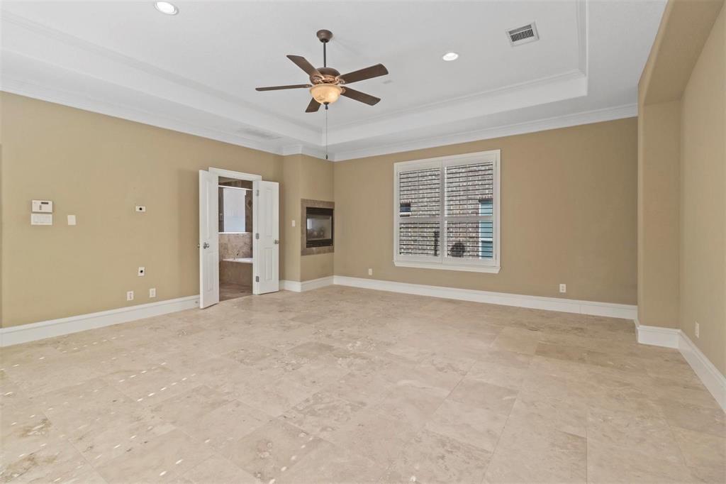 4516 Gilbert Avenue Dallas, TX 75219 - Photo 18 of 29 Owner's Suite with Fire place into bathroom