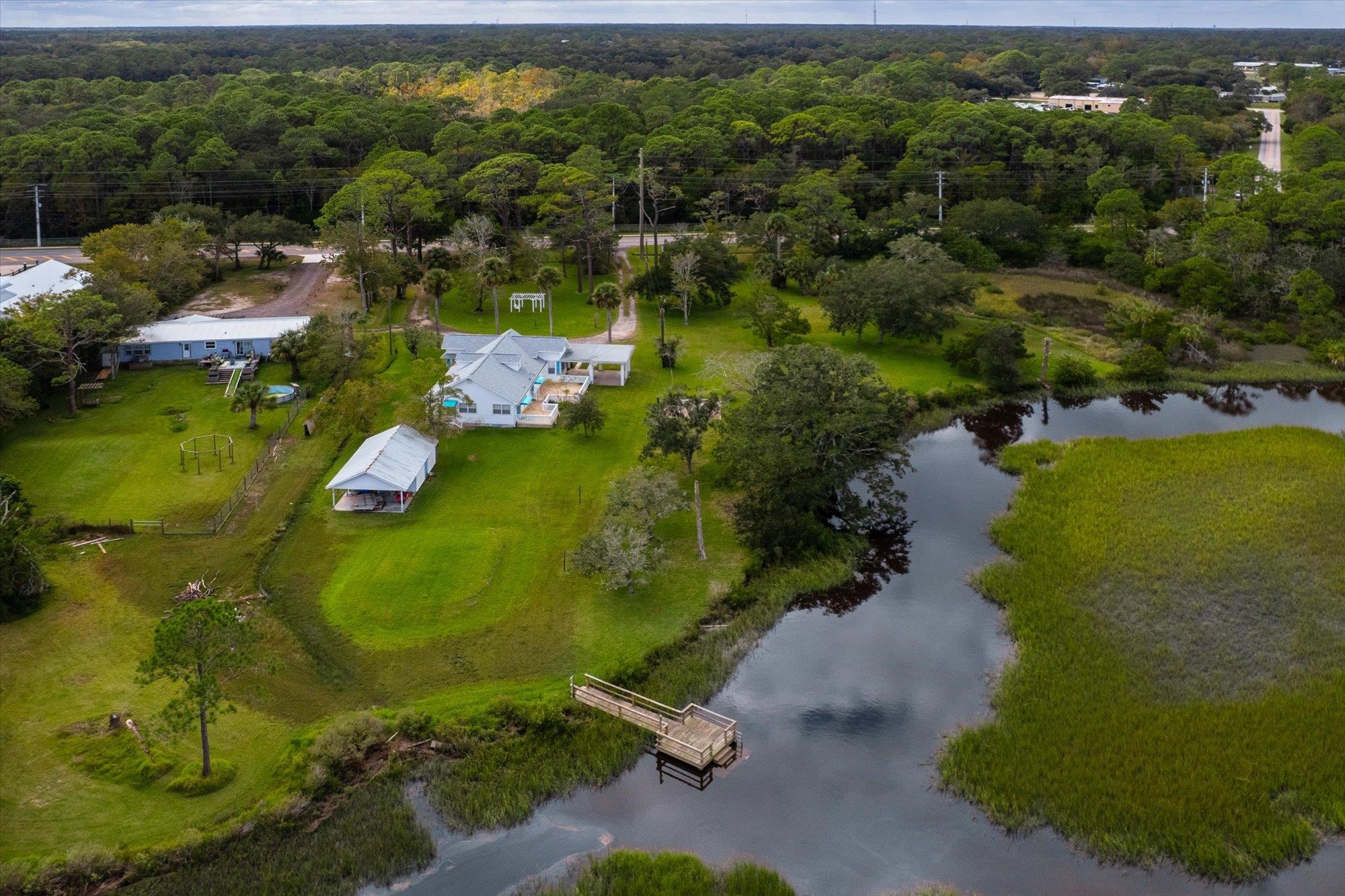 3040 Lewis Speedway St. Augustine, FL 32084 - Photo 5 of 6 an aerial view of residential houses with outdoor space