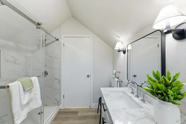 a view of a house with backyard sitting area and garden