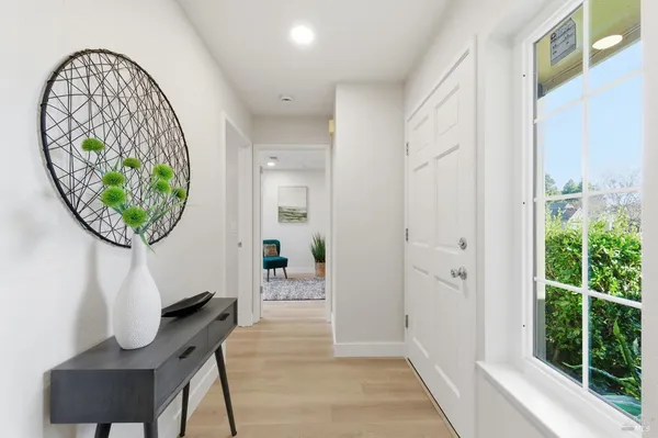 a kitchen with stainless steel appliances granite countertop a sink a stove a refrigerator and cabinets