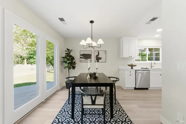 a view of a dining room with furniture window and outside view