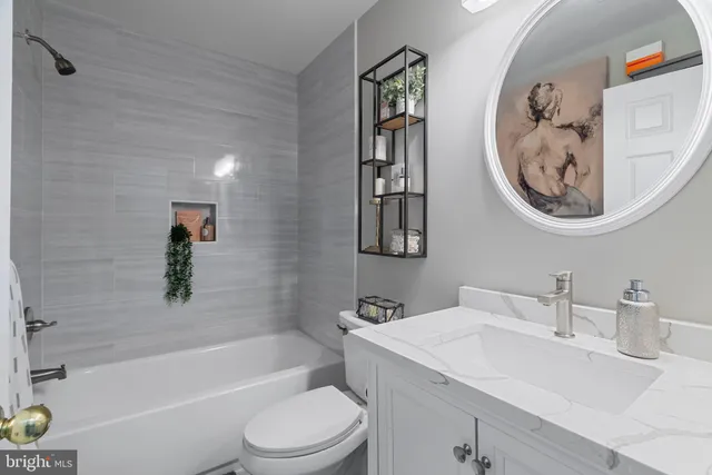 a bathroom with a toilet a sink and a bathtub