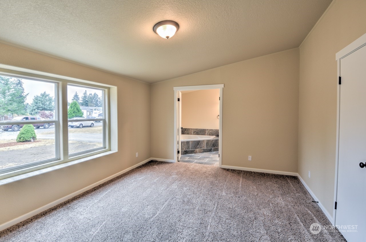 19212 Old Ranch Lane Southwest Rochester, WA 98579 - Photo 14 of 33 a view of an empty room with a window