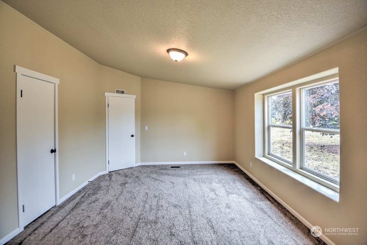 19212 Old Ranch Lane Southwest Rochester, WA 98579 - Photo 16 of 33 a view of an empty room with a window