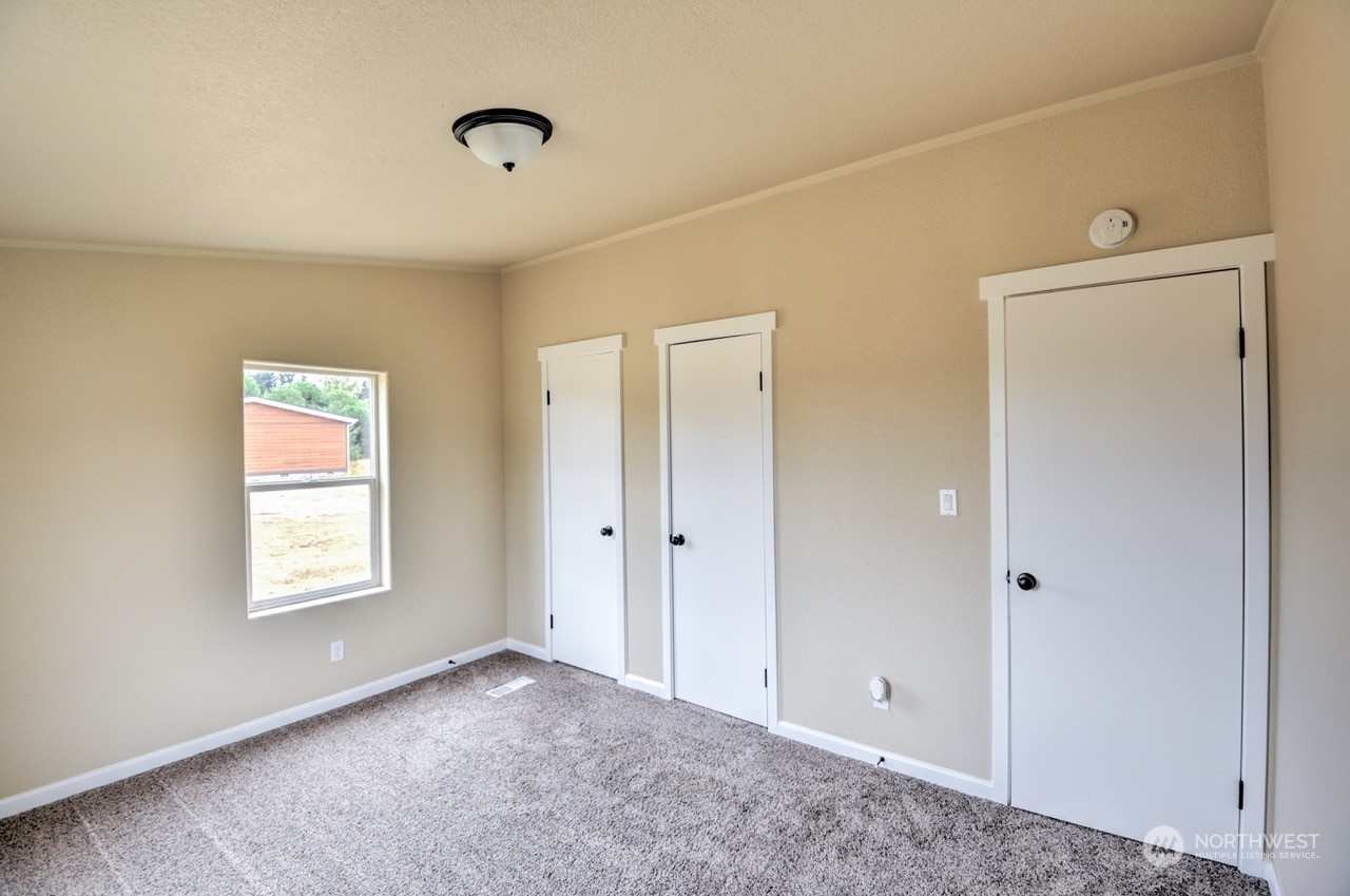 19212 Old Ranch Lane Southwest Rochester, WA 98579 - Photo 20 of 33 a view of an empty room and window