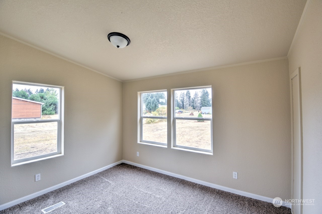 19212 Old Ranch Lane Southwest Rochester, WA 98579 - Photo 23 of 33 a view of an empty room with a window
