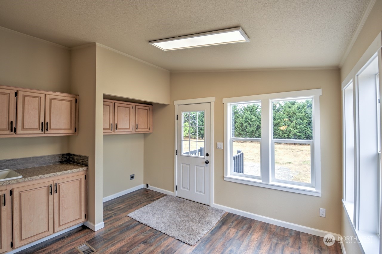 19212 Old Ranch Lane Southwest Rochester, WA 98579 - Photo 25 of 33 a view of kitchen with granite countertop cabinets and window