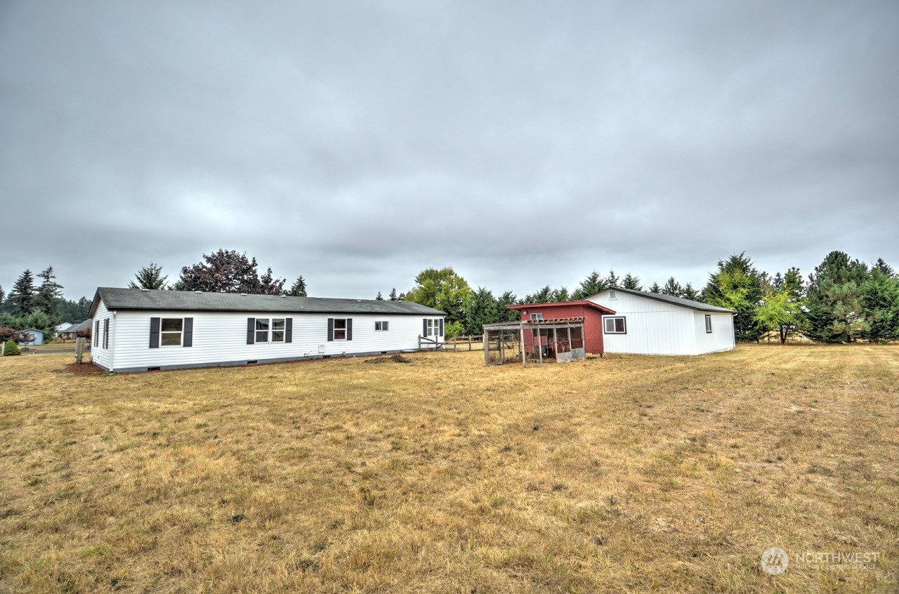 19212 Old Ranch Lane Southwest Rochester, WA 98579 - Photo 26 of 33 view of house with an outdoor space and seating