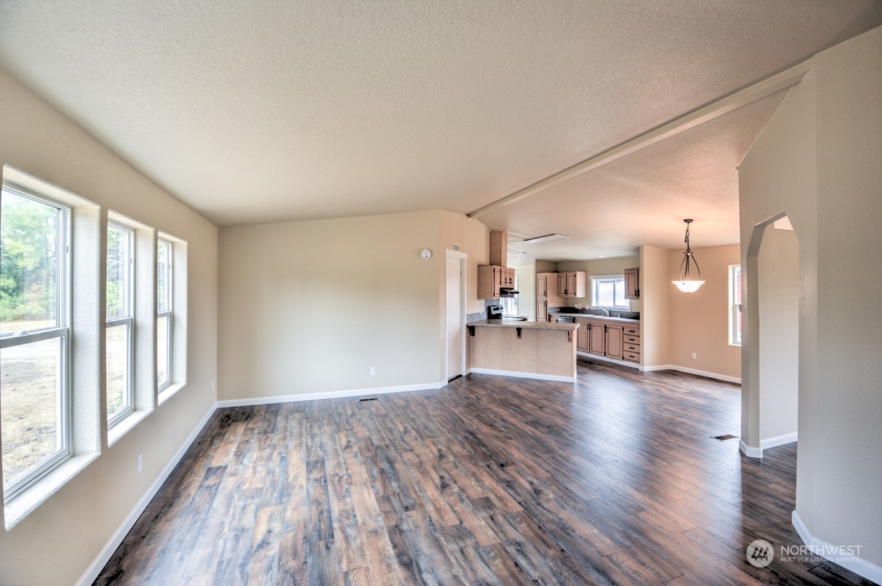 19212 Old Ranch Lane Southwest Rochester, WA 98579 - Photo 8 of 33 a view of a livingroom with wooden floor