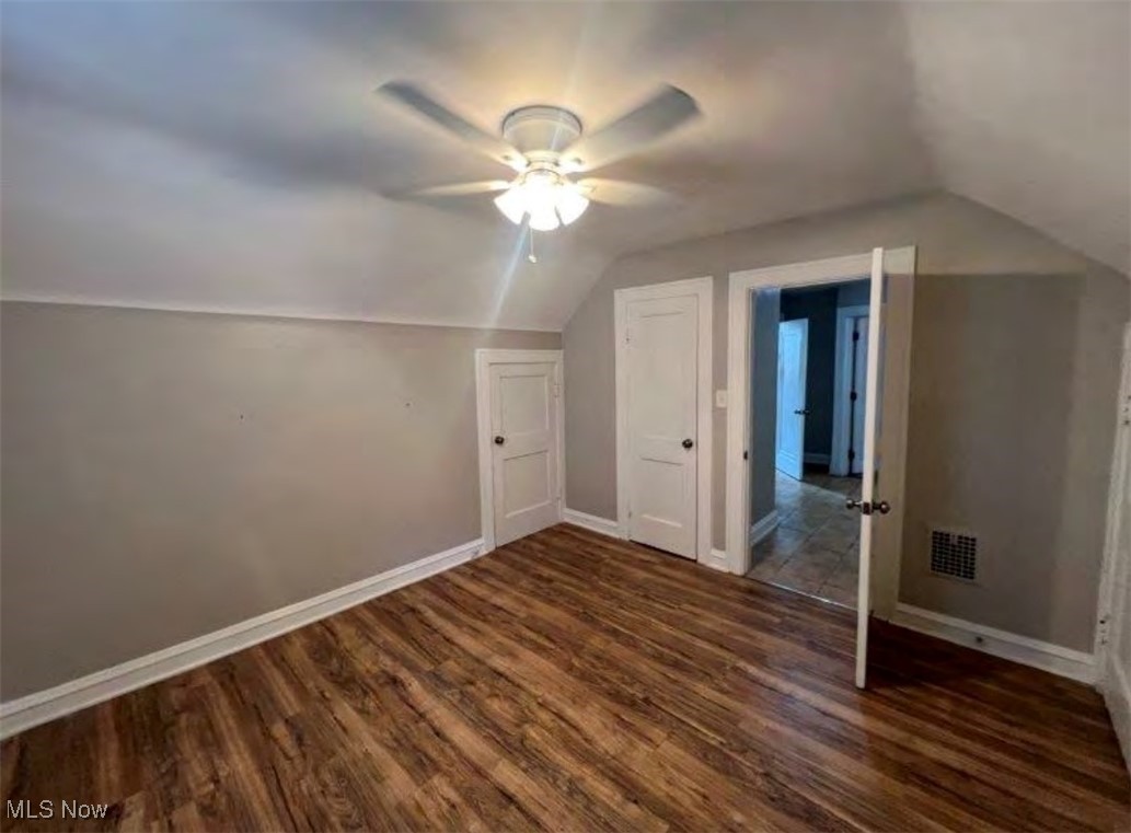 3579 Riedham Road Cleveland, OH 44120 - Photo 5 of 13 Bonus room with lofted ceiling, ceiling fan, and dark hardwood / wood-style floors