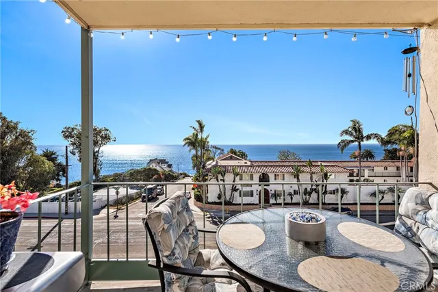 a view of a couches and dinning table in patio