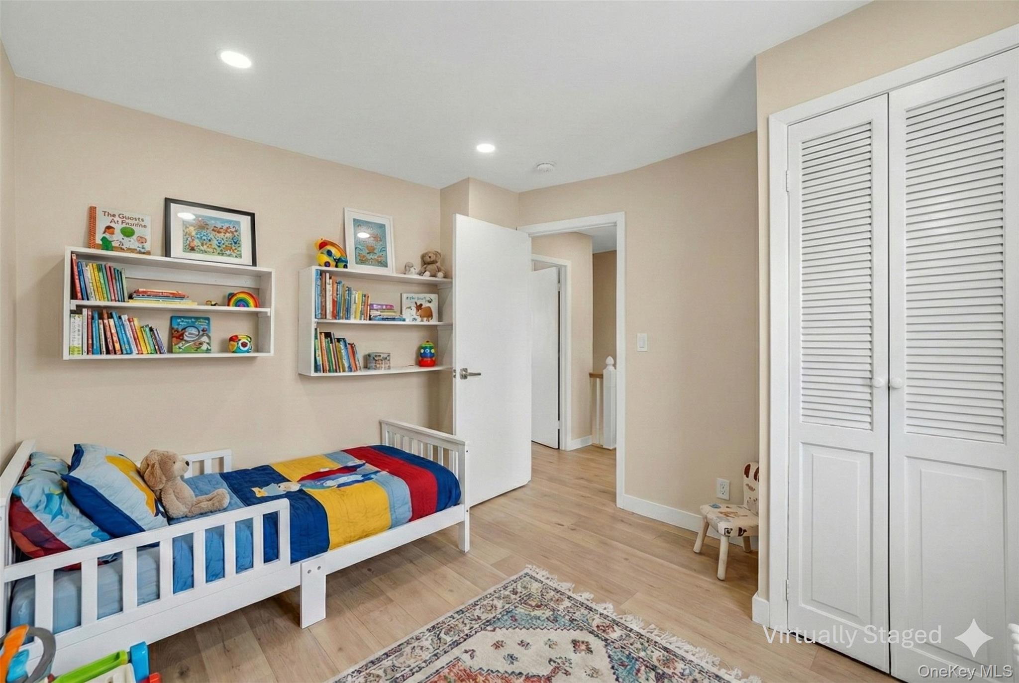 41 Devoe Street Dobbs Ferry, NY 10522 - Photo 17 of 28 a bedroom with furniture and a book shelf