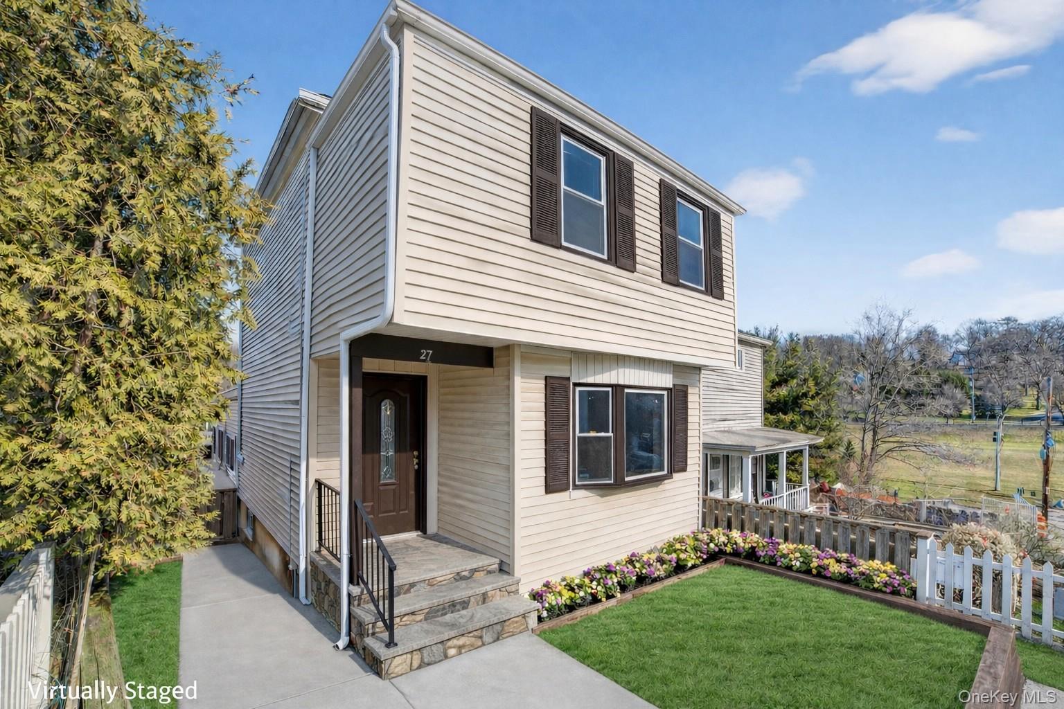 41 Devoe Street Dobbs Ferry, NY 10522 - Photo 4 of 28 a front view of a house with a garden