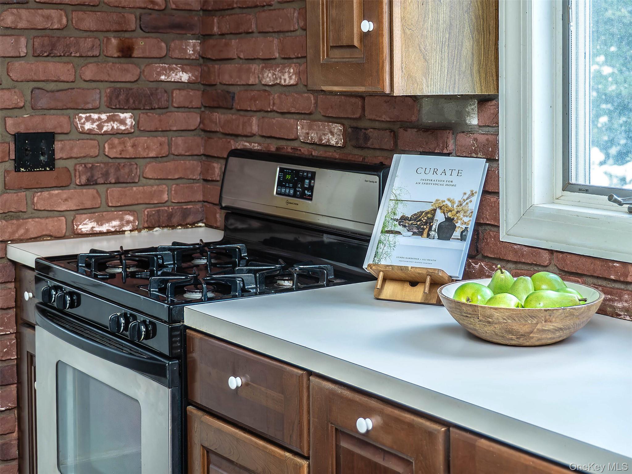 24 Orchard Farm Road Port Washington, NY 11050 - Photo 13 of 20 a stove top oven sitting inside of a kitchen