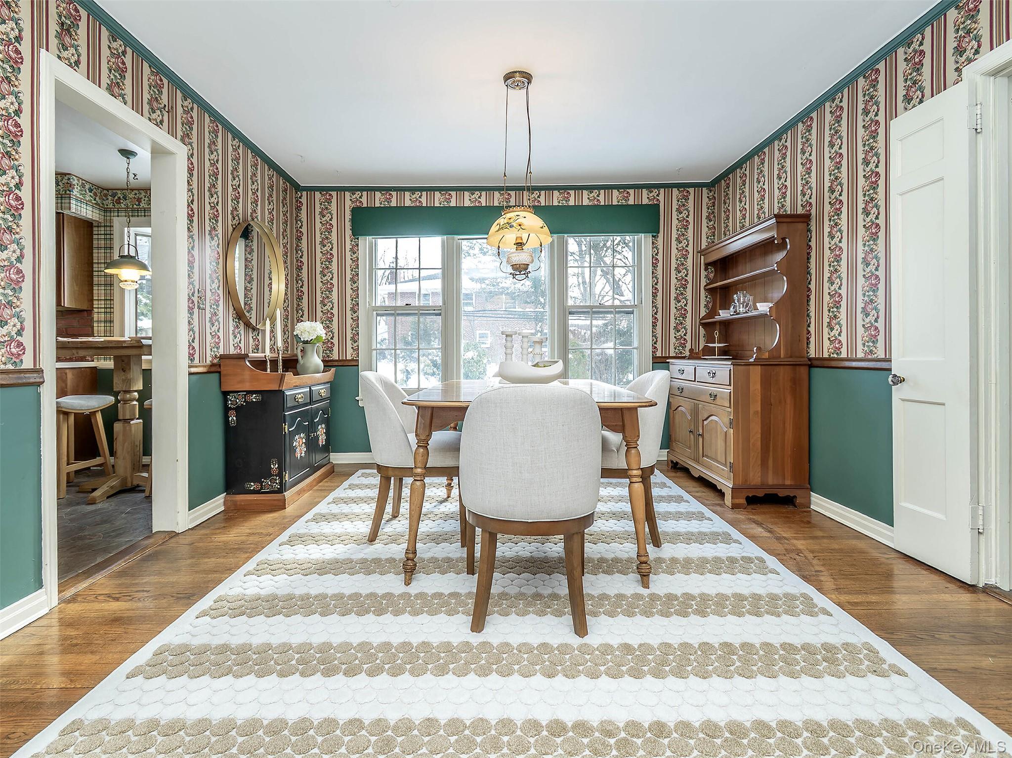 24 Orchard Farm Road Port Washington, NY 11050 - Photo 14 of 20 a view of a dining room with furniture window and outside view