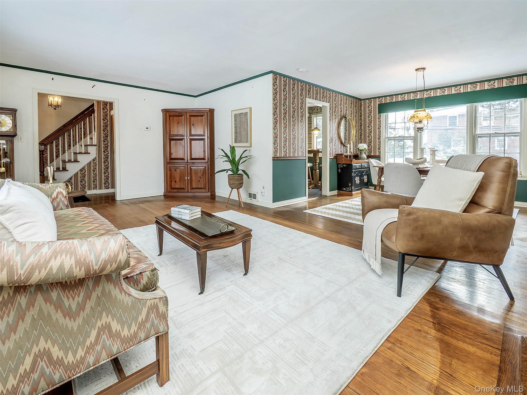 24 Orchard Farm Road Port Washington, NY 11050 - Photo 3 of 20 a living room with furniture and a large window