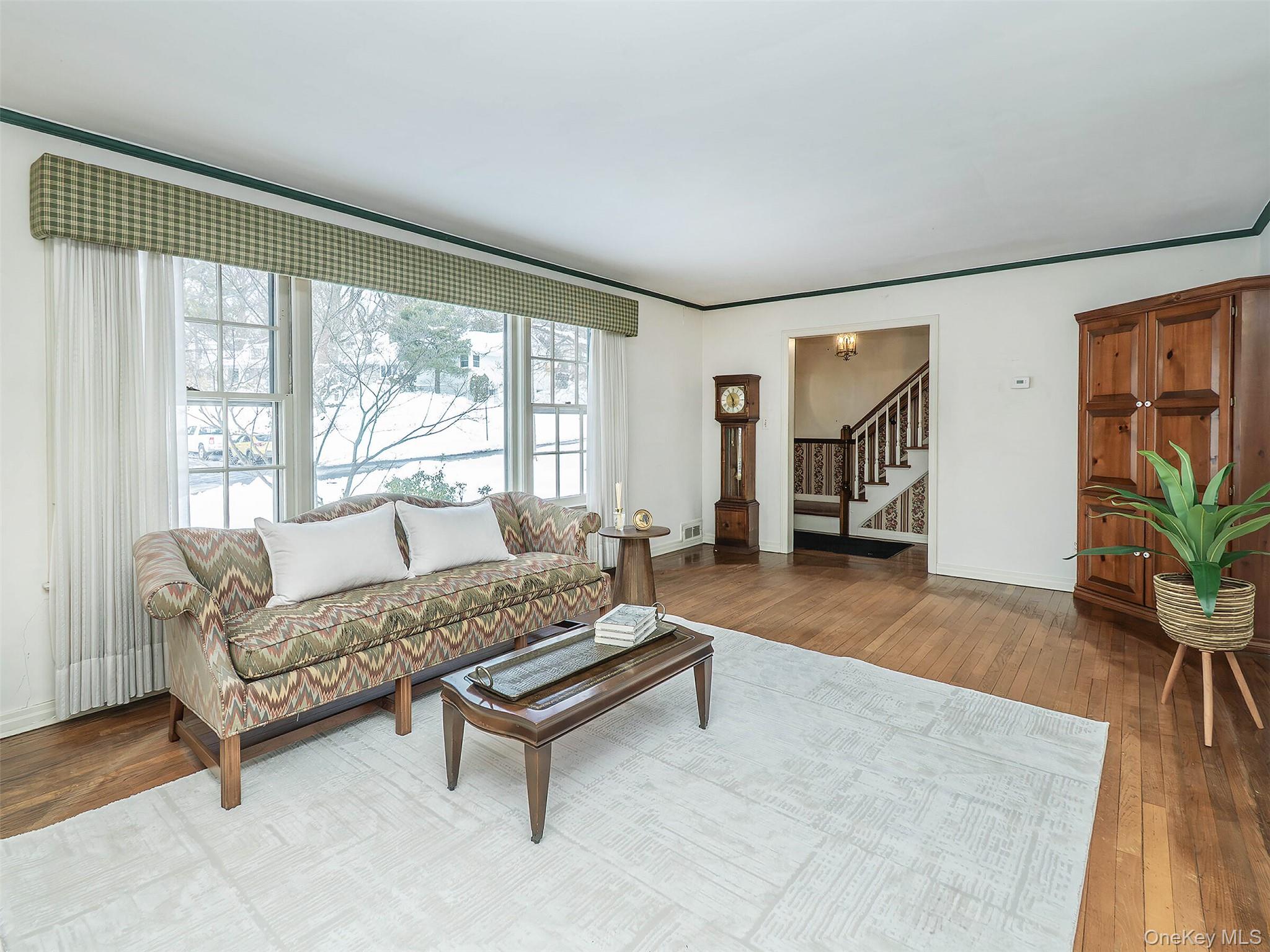 24 Orchard Farm Road Port Washington, NY 11050 - Photo 6 of 20 a living room with furniture and a large window