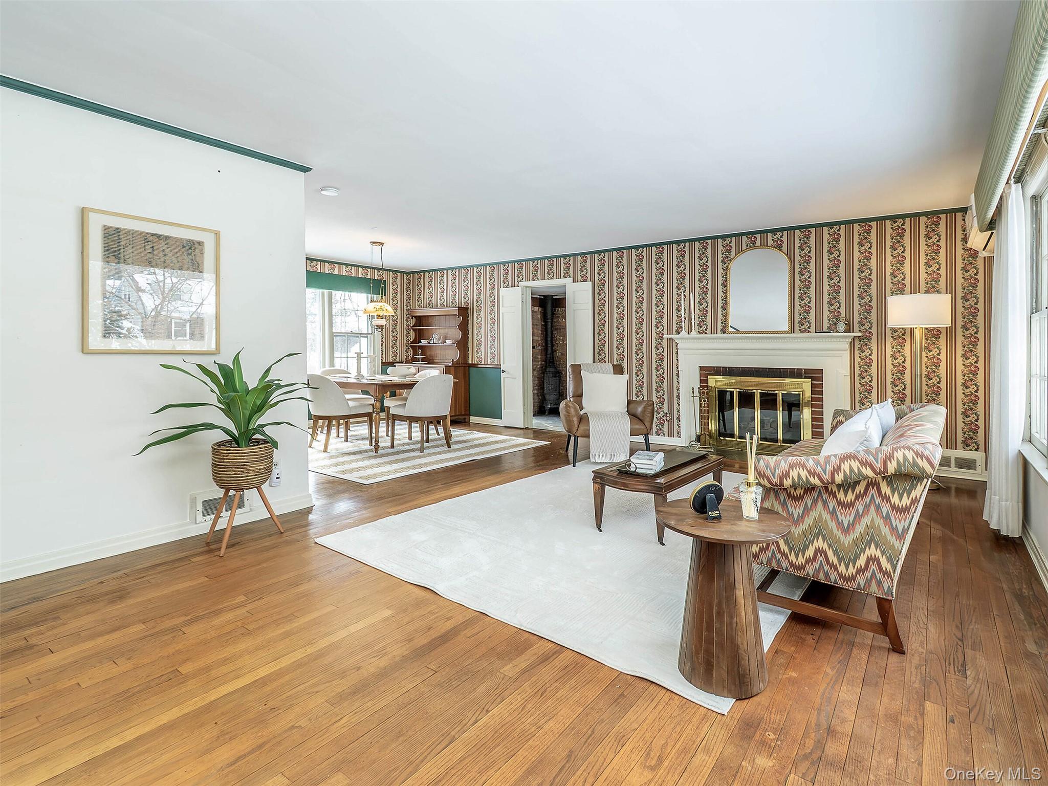 24 Orchard Farm Road Port Washington, NY 11050 - Photo 7 of 20 a living room with furniture fireplace and a table
