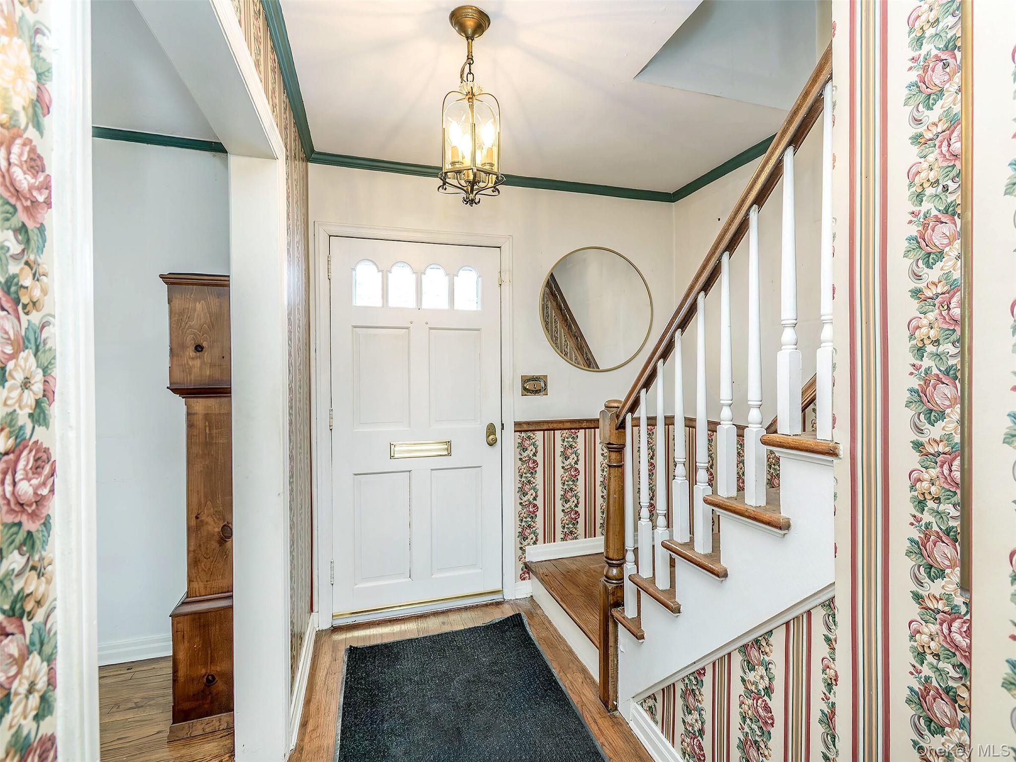 24 Orchard Farm Road Port Washington, NY 11050 - Photo 8 of 20 a view of an entryway with wooden floor and door