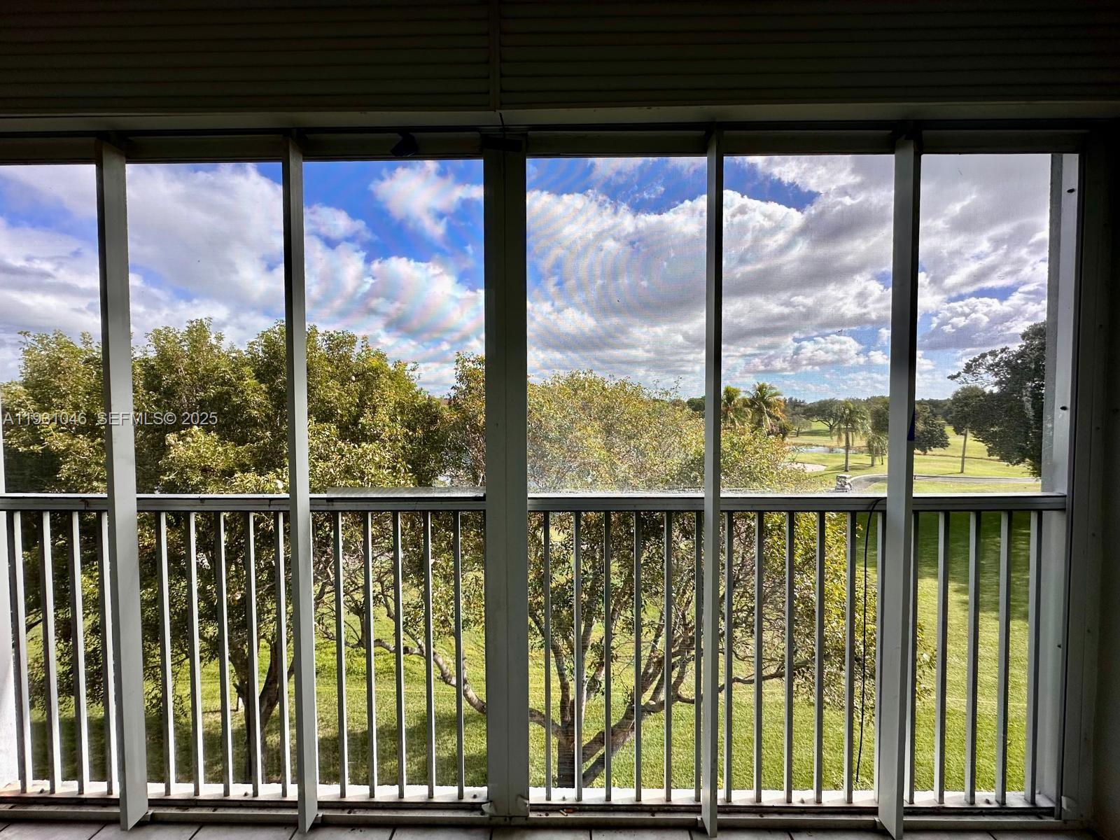 301 Southwest 135th Avenue, Unit 415C Pembroke Pines, FL 33027 - Photo 11 of 13 a view of a large window with an outdoor view